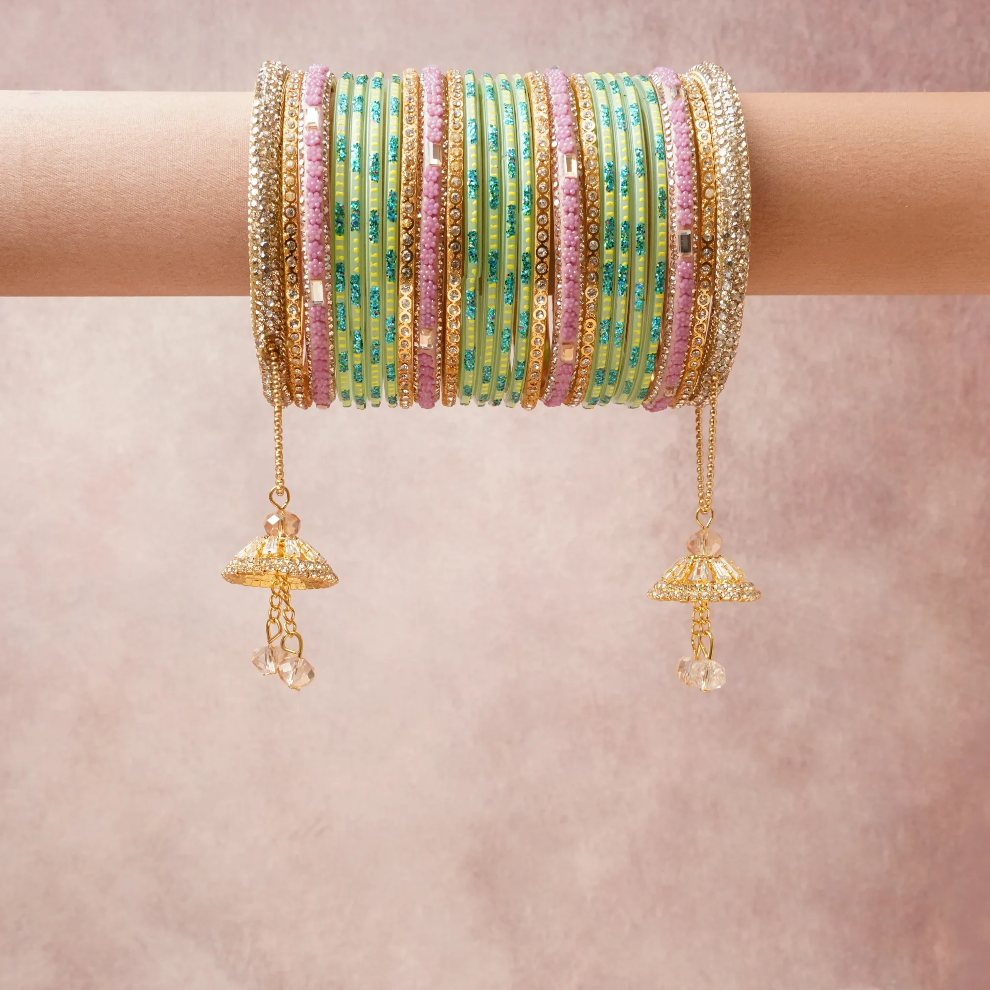 A grounding Green forms the heart of the set, while touches of Clear, Teal, Yellow, Champagne add charm.

A thoughtful composition of Gold-Toned Alloy, Glass, Crystal, Rhinestone, designed to feel complete without being heavy.
Each element layers seamlessly, creating a look that is refined, wearable and quietly striking.